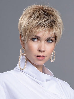 A short pixie that offers longer lengths in the top and crown area for versatile styling