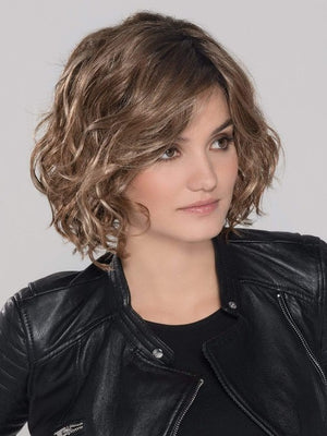 A trendy, mid length style with perfectly placed layers. The monofilament part placement offers the perfect amount of volume