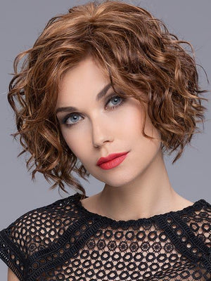 Turn is an ultra-gorgeous, mid-length style full of curls throughout