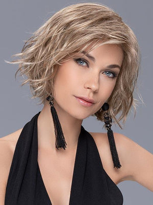 Soft tossed waves and side swept bangs look great in the synthetic fiber that has been specially selected