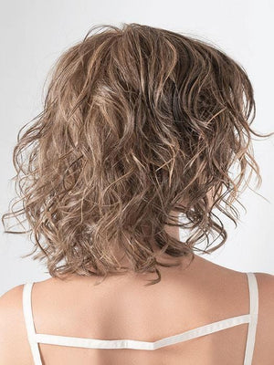 A beautifully feminine style with loose beach waves